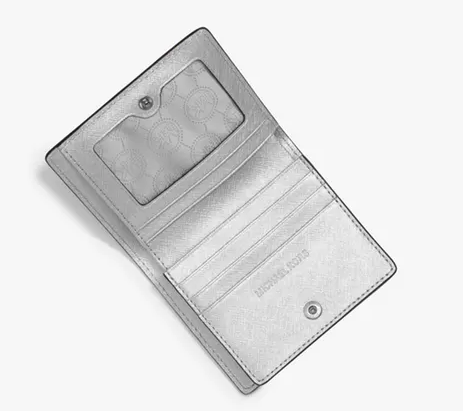 额外8折不可错过的小物件！Michael Kors “Jet Set Tr*el” 金属十字纹皮钱包 .64（约236元）