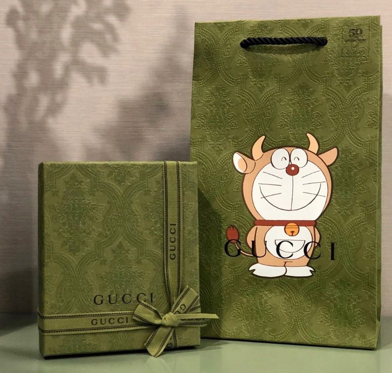 gucci和哆啦a梦联名款小钱包,真的是个百包袋没错了,海淘攻略-55海淘