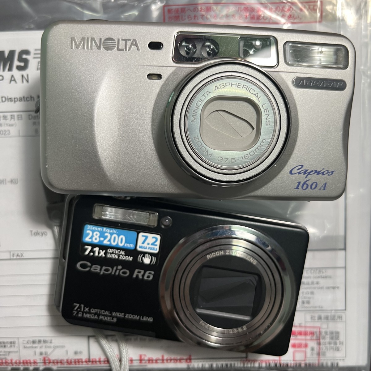 这次海淘到了一台胶片机和一台CCD（带电池充电器 合箱服务超